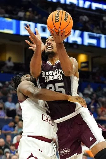 Mississippi State forward Tolu Smith goes up to shoot against South Carolina forward Josh Gray during the first half of an NCAA men's college basketball game at the Southeastern Conference tournament in Tampa, Fla., Thursday, March 10, 2022. (AP Photo/Chris O'Meara)
