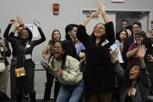 Issue 1 supporters celebrate as Rhiannon Carnes, executive director, Ohio Women's Alliance, speaks at a watch party, Tuesday, Nov. 7, 2023, in Columbus Ohio. (AP Photo/Sue Ogrocki)