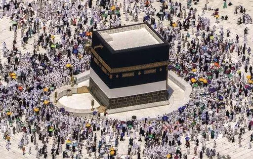 Muslim pilgrims walk around the Kaaba, the cubic building at the Grand Mosque, during the annual hajj pilgrimage, in Mecca, Saudi Arabia, on July 10, 2022. Islam's annual hajj pilgrimage in Saudi Arabia will return to pre-pandemic levels in 2023 after restrictions saw the annual religious commemoration curtailed over concerns about the coronavirus, authorities say. (AP Photo/Amr Nabil, File)